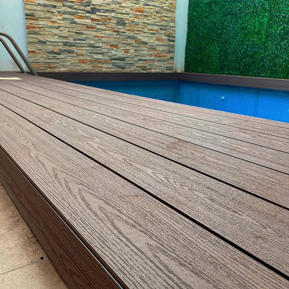 Close-up of WPC deck boards at the edge of a pool
