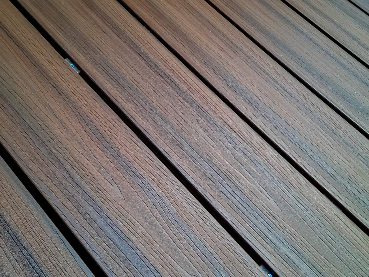 Close-up of WPC deck boards laid on a diagonal