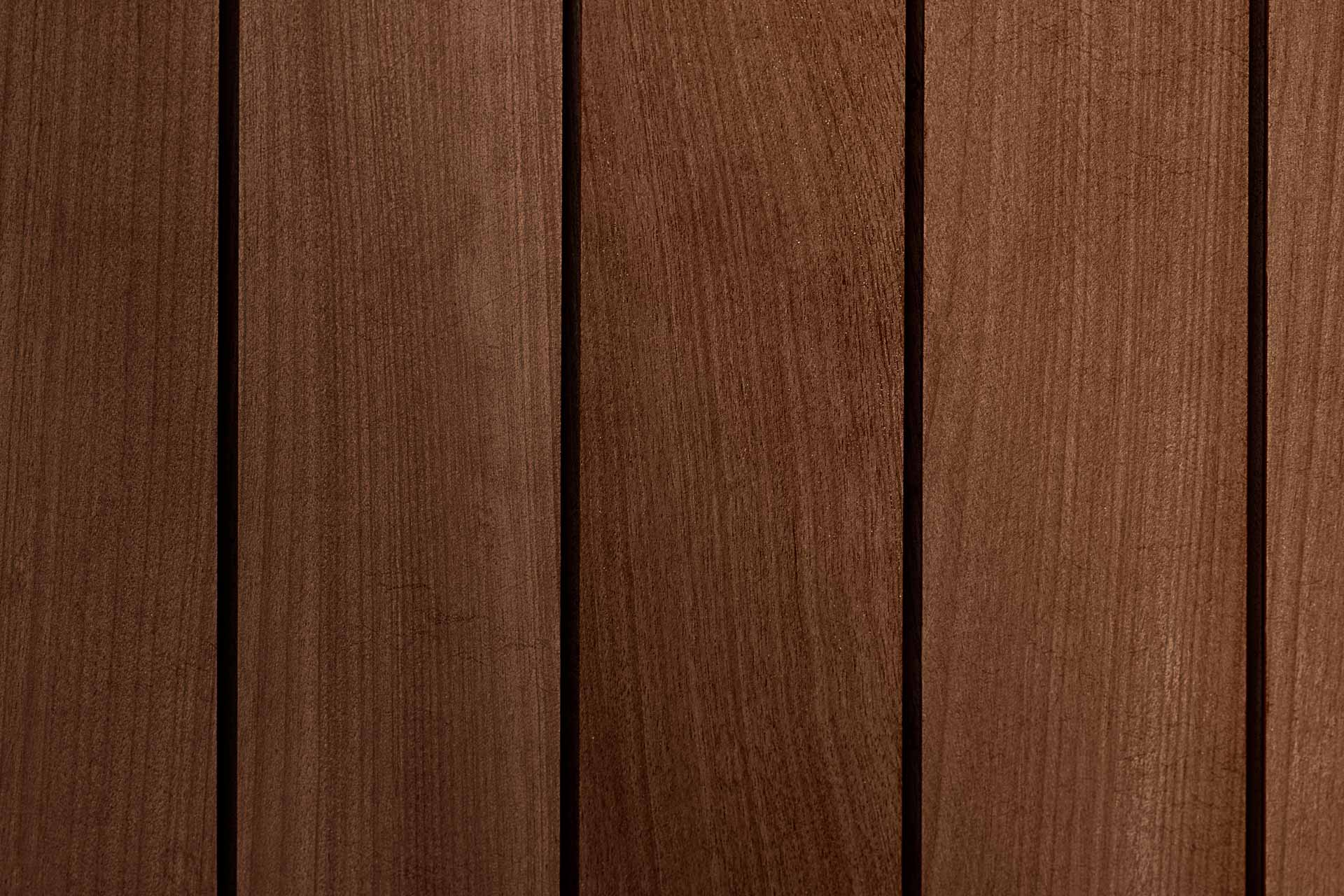 Close-up of reddish wood-tone WPC boards