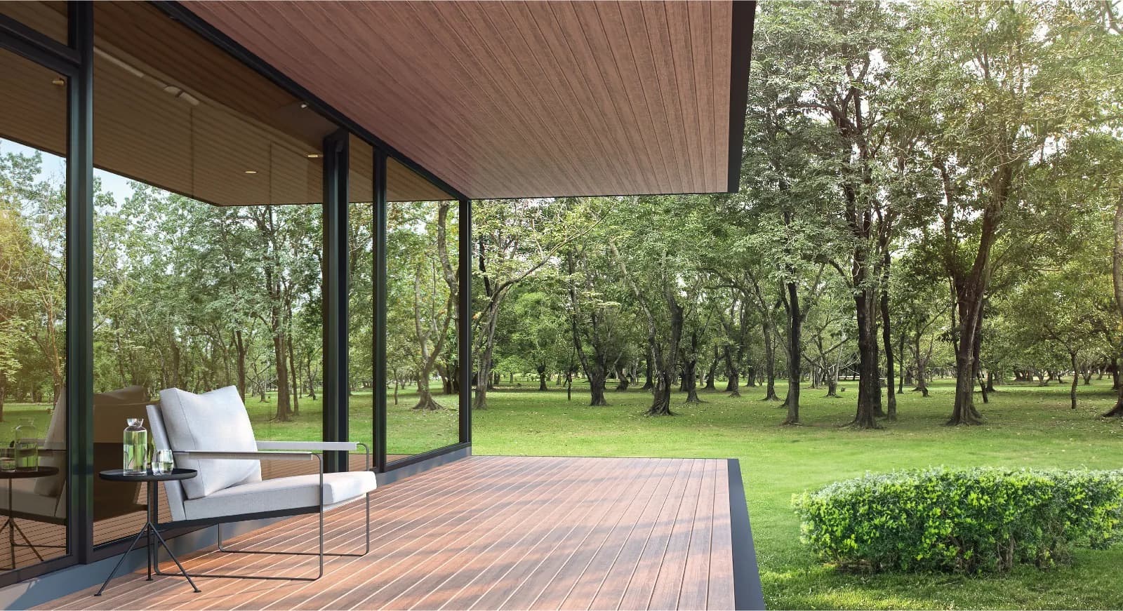 Covered patio with a WPC soffit above and WPC decking below, open to a wooded garden