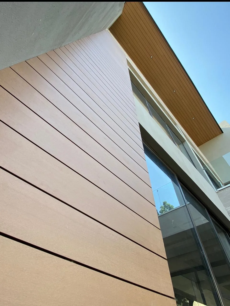 Close-up of a wall clad in horizontal WPC boards