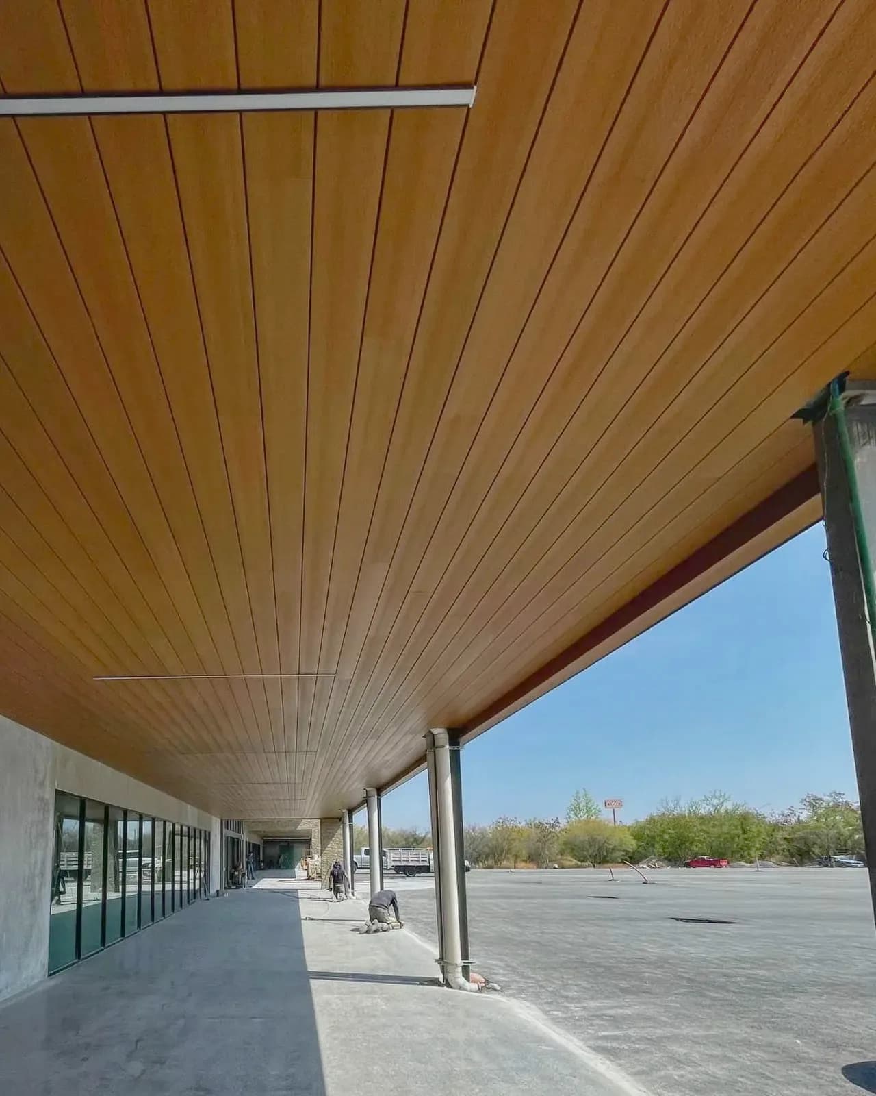 Outdoor shopping center walkway with a WPC board ceiling